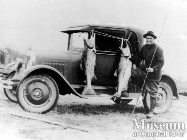 Angler with catch of Tyee salmon