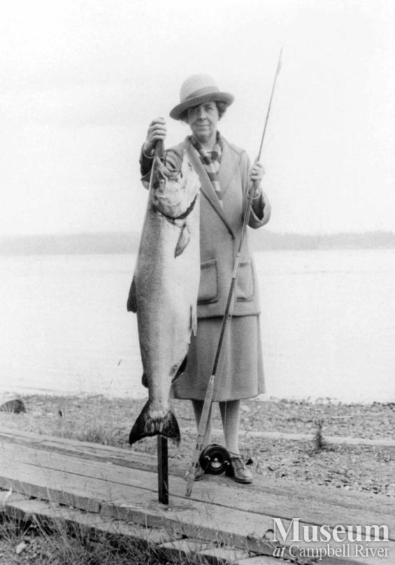 Unknown lady angler with fish