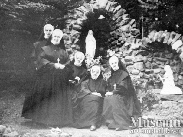 Group of the Sisters beside the Grotto at the Lourdes Hospital