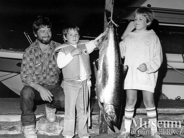 Man and two children