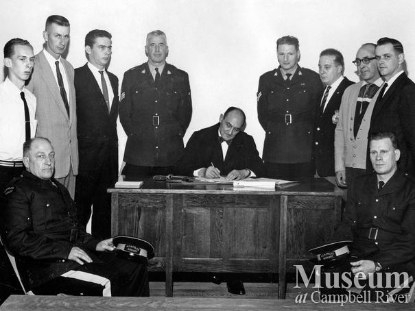 Judge Roderick Haig-Brown with police officers, Campbell River